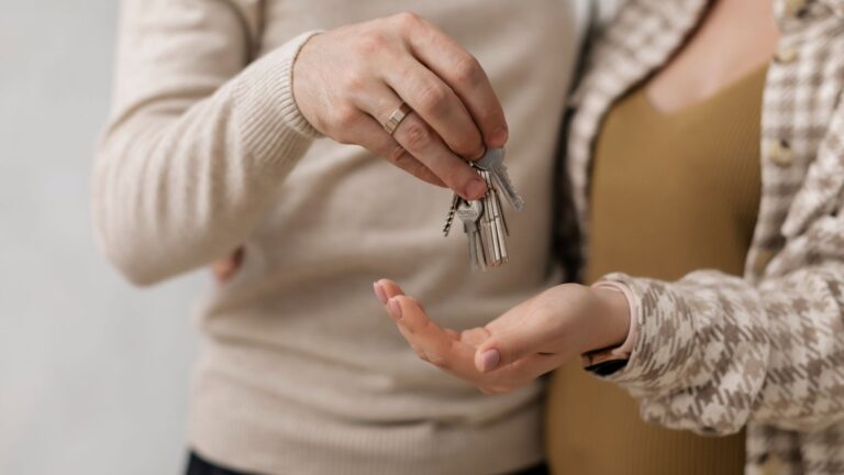 Couple holding the keys to a new house