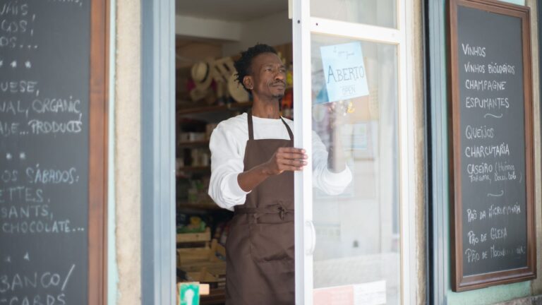 Small business owner in an apron in their shop