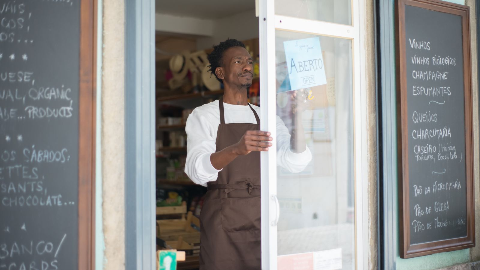 Small business owner in an apron in their shop