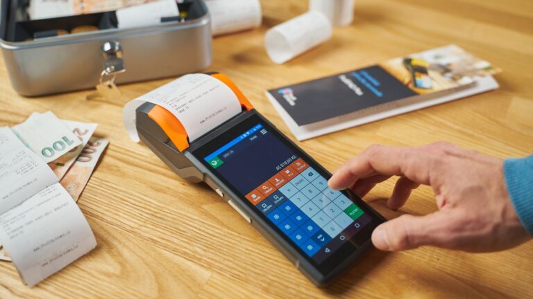 Card terminal and printed receipts on a desk