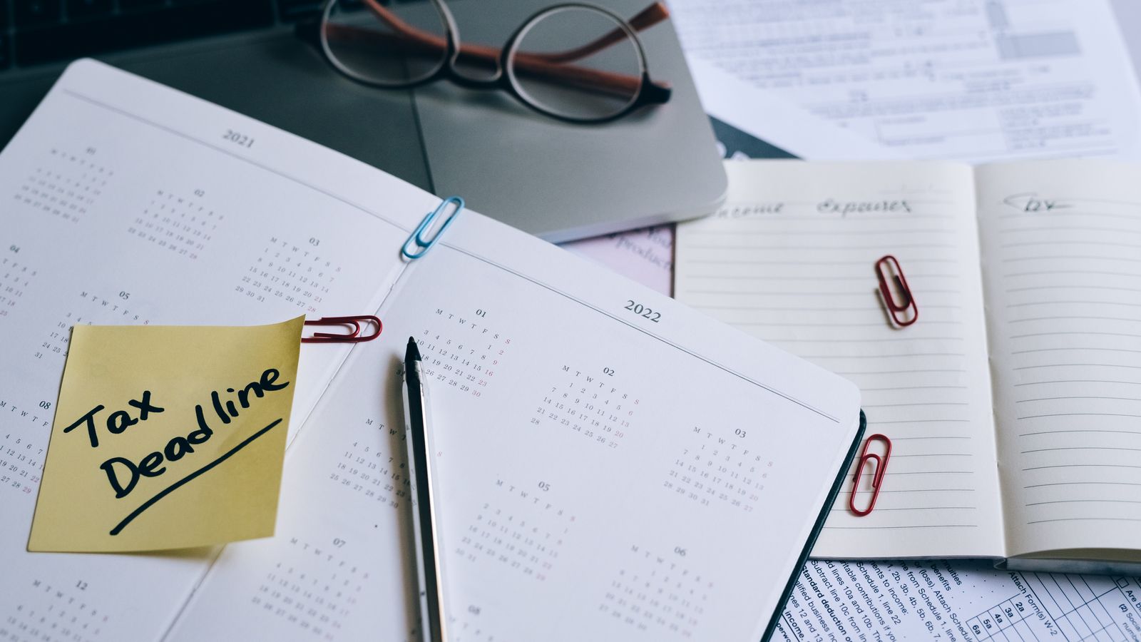 Open planner with a handwritten tax deadline reminder